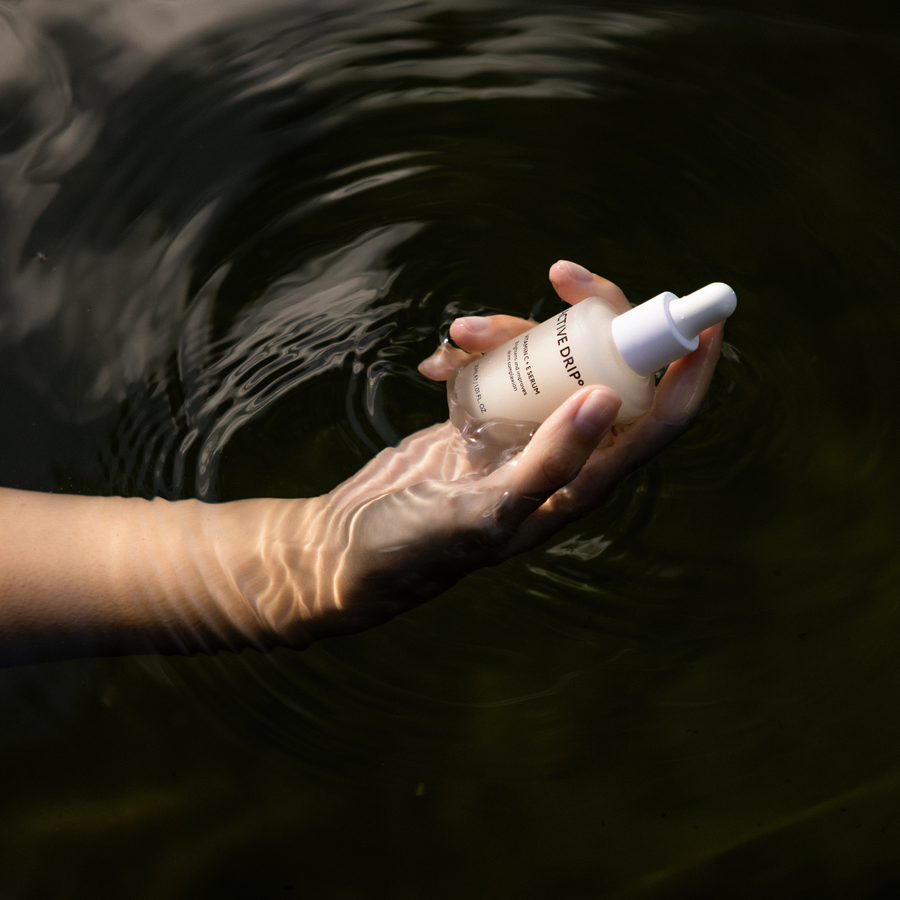 Active Drip C + E Drip serum bottle submerged in water